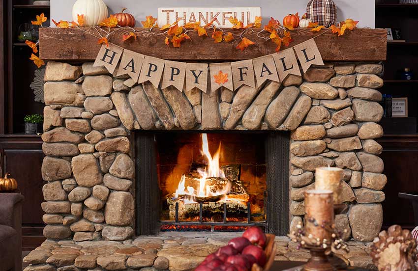 fireplace decorated with fall decor