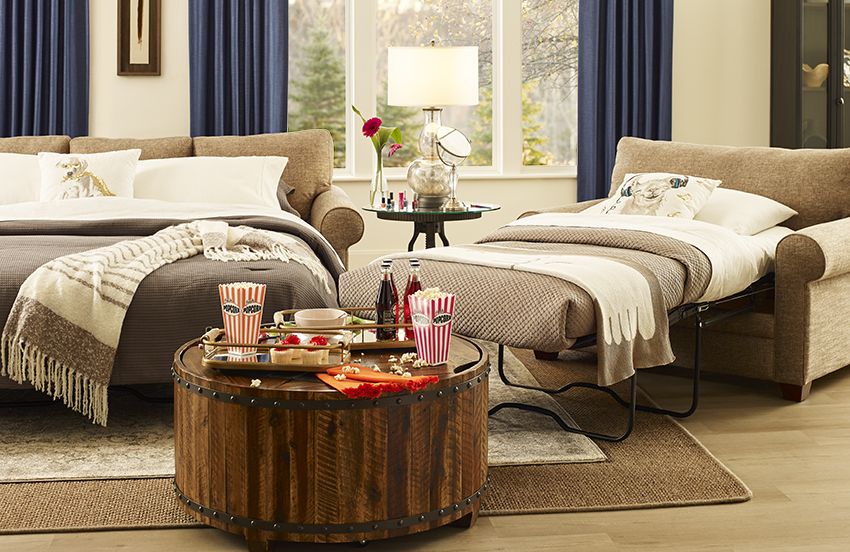 Cozy living room with sleeper sofa ready for overnight guests.