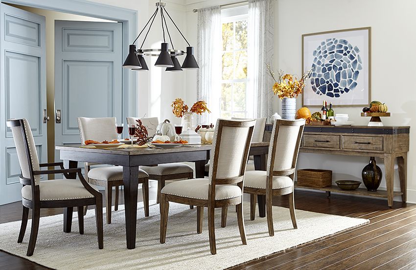 ining table extended for a family dinner with simple holiday décor.