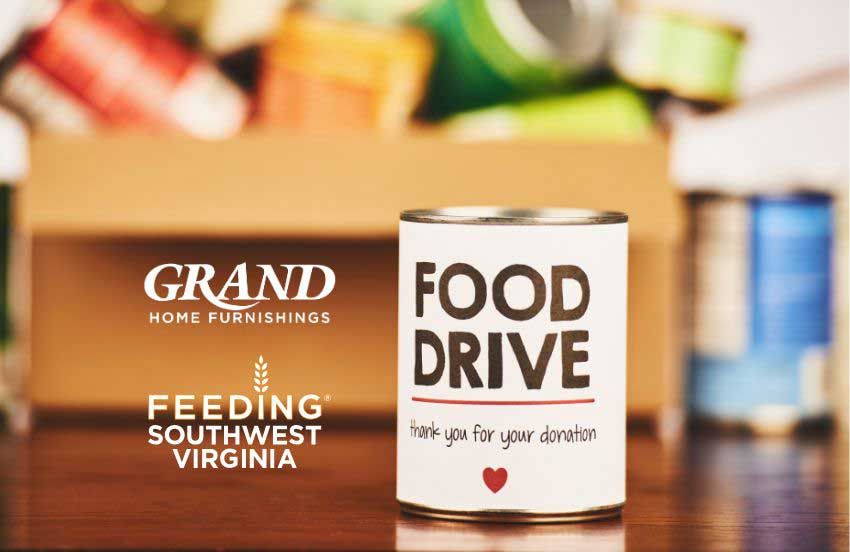 Food donation box for Feeding Southwest Virginia at a Grand Home Furnishings store entrance.